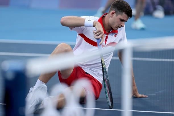 Hubert Hurkacz of Team Poland picks himself up after a fall during his Men's Singles Second Round match against Liam Broady of Team Great Britain on...
