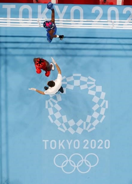 Referee Manuel Vilarino of Argentina counts to Elizabeth Akinyi of Kenya during the Women's Welter on day four of the Tokyo 2020 Olympic Games at...