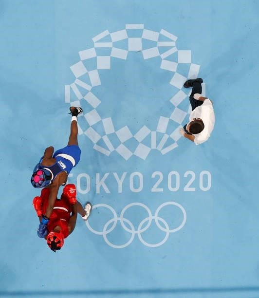 Elizabeth Akinyi of Kenya exchanges punches with Alcinda Helena Panguana of Mozambique during the Women's Welter on day four of the Tokyo 2020...