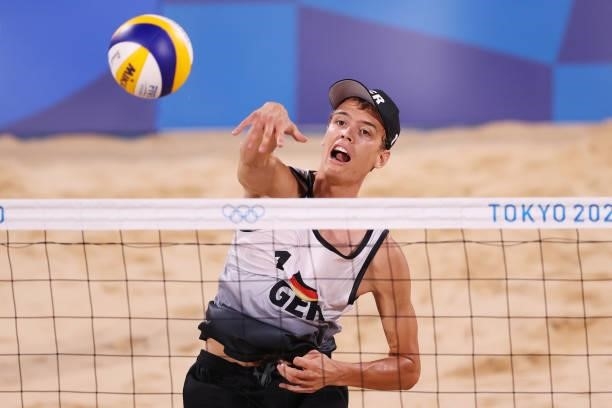Julius Thole of Team Germany competes against Team Poland during the Men's Preliminary - Pool F beach volleyball on day four of the Tokyo 2020...