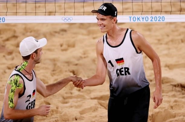 Julius Thole and Clemens Wickler of Team Germany react against Team Poland during the Men's Preliminary - Pool F beach volleyball on day four of the...