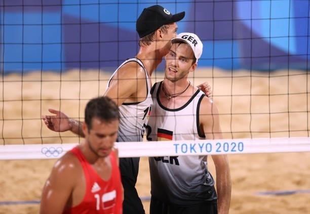 Julius Thole and Clemens Wickler of Team Germany react against Team Poland during the Men's Preliminary - Pool F beach volleyball on day four of the...