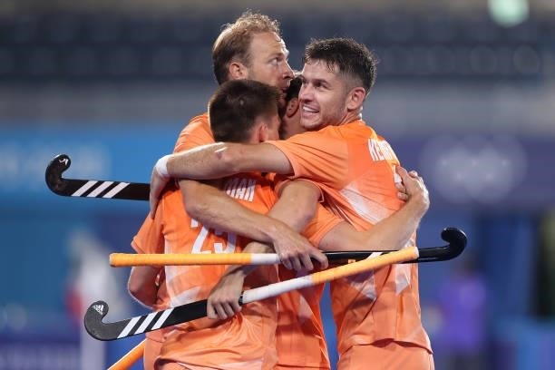 Thierry Brinkman of Team Netherlands celebrates with teammates Roel Bovendeert, Billy Bakker and Robbert Kemperman after scoring their team's second...