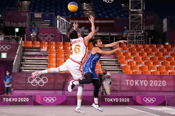 Shuyu Yang of Team China and Raelin D Alie of Team Italy compete for the ball in the 3x3 Basketball competition on day four of the Tokyo 2020 Olympic...