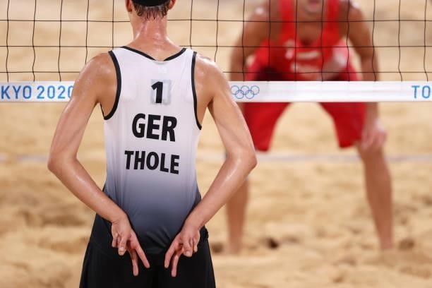 Julius Thole of Team Germany competes against Team Poland during the Men's Preliminary - Pool F beach volleyball on day four of the Tokyo 2020...