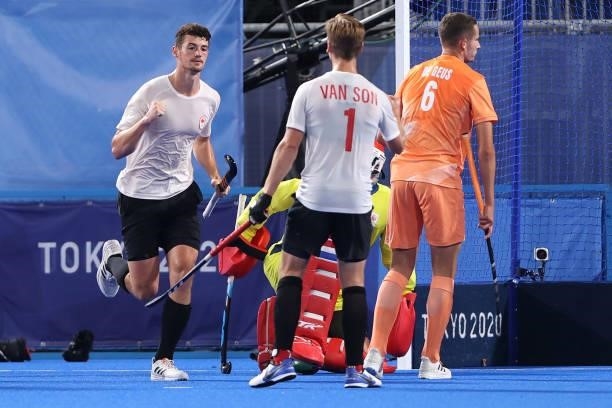 James Brodie Burns Wallace of Team Canada celebrates with teammate Floris Frederik van Son after scoring their team's first goal during the Men's...