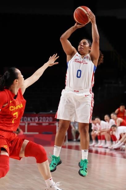 Jennifer O'Neill of Team Puerto Rico shoots over Ting Shao of Team China during the first half of a Women's Preliminary Round Group C game on day...