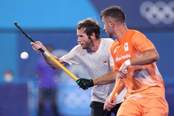 James Alexander Paget Kirkpatrick of Team Canada controls the ball whilst under pressure from Robbert Kemperman of Team Netherlands during the Men's...