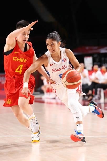 Pamela Rosado of Team Puerto Rico drives to the basket against Yuan Li of Team China during the first half of a Women's Preliminary Round Group C...