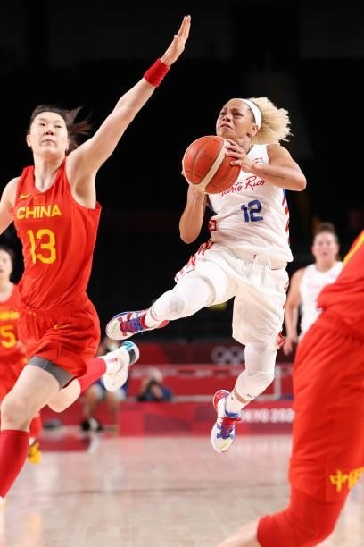 Dayshalee Salaman of Team Puerto Rico drives to the basket against Mengran Sun of Team China during the first half of a Women's Preliminary Round...