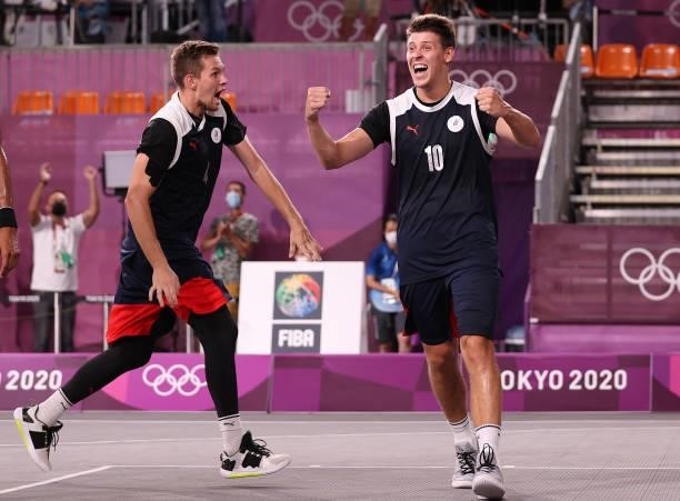 Stanislav Sharov of Team ROC0 and Alexander Zuev of Team ROC celebrate victory in the 3x3 Basketball competition on day four of the Tokyo 2020...