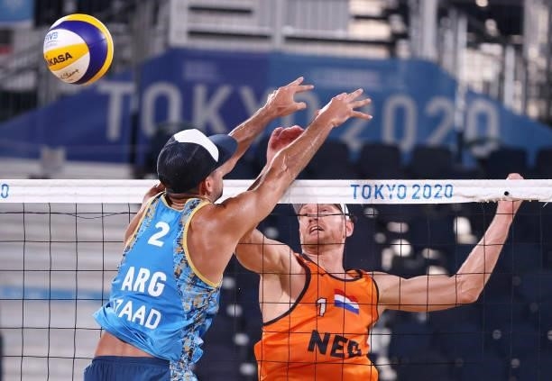 Alexander Brouwer of Team Netherlands competes against Julian Amado Azaad of Team Argentina during the Men's Preliminary - Pool D beach volleyball on...