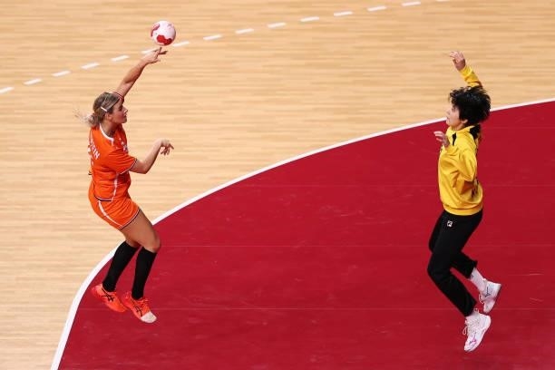 Angela Malestein of Team Netherlands shoots for goal as Ju Hui of Team South Korea looks to save during the Woman's Preliminary Round Group A match...