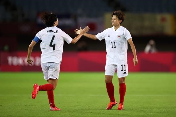 Mina Tanaka of Team Japan celebrates with Saki Kumagai after scoring their side's first goal during the Women's Group E match between Chile and Japan...
