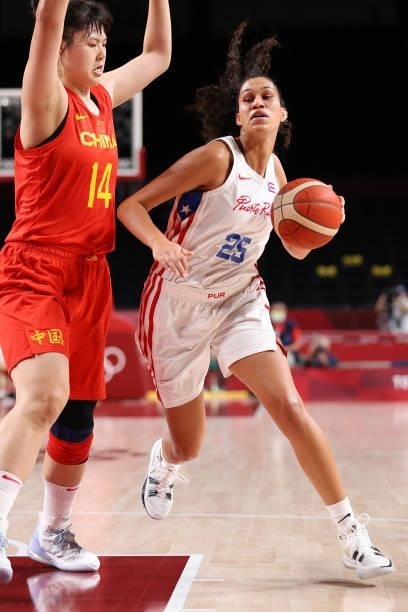 Isalys Quinones of Team Puerto Rico drives to the basket against Yueru Li of Team China during the first half of a Women's Preliminary Round Group C...