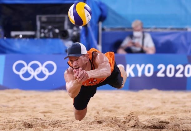 Alexander Brouwer of Team Netherlands competes against Team Argentina during the Men's Preliminary - Pool D beach volleyball on day four of the Tokyo...