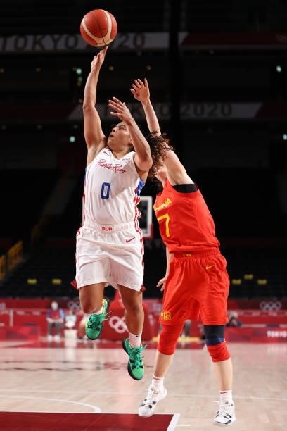 Jennifer O'Neill of Team Puerto Rico drives past Ting Shao of Team China during the first half of a Women's Preliminary Round Group C game on day...