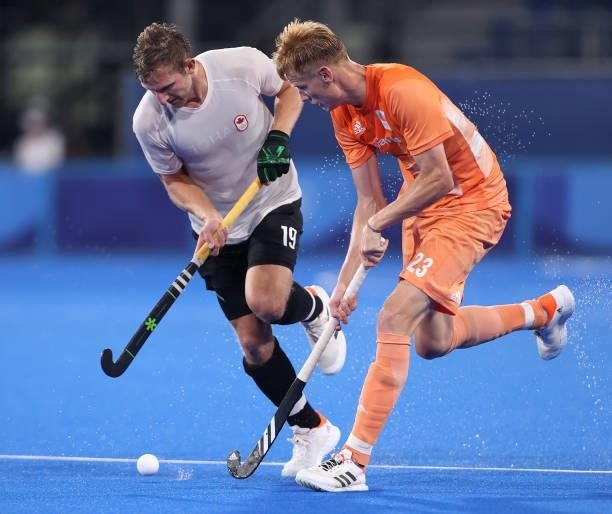 Mark Alistair John Pearson of Team Canada and Joep Paul Eric de Mol of Team Netherlands battle for the ball during the Men's Preliminary Pool B match...