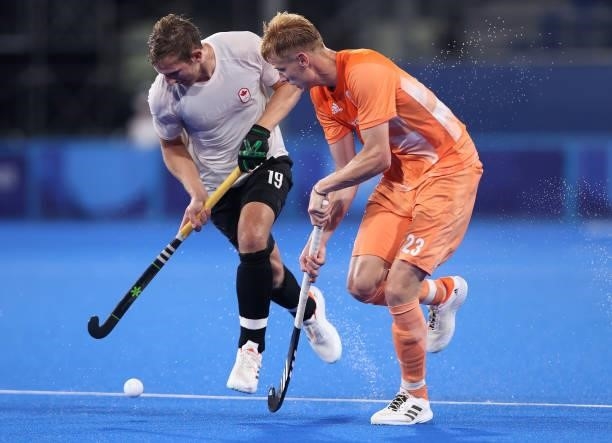 Mark Alistair John Pearson of Team Canada and Joep Paul Eric de Mol of Team Netherlands battle for the ball during the Men's Preliminary Pool B match...
