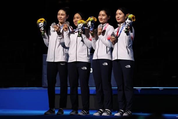 Silver medalists Injeong Choi, Young Mi Kang, Sera Song and Hyein Lee of Team South Korea pose with the silver medal during the Women's Epée Team...