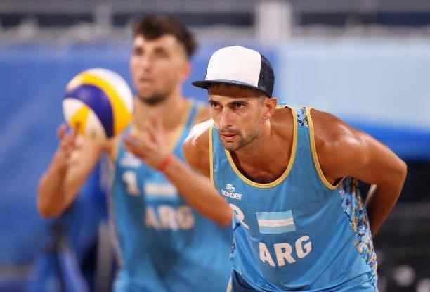Julian Amado Azaad and Nicolas Capogrosso of Team Argentina compete against Team Netherlands during the Men's Preliminary - Pool D beach volleyball...