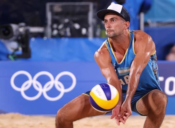Julian Amado Azaad of Team Argentina competes against Team Netherlands during the Men's Preliminary - Pool D beach volleyball on day four of the...