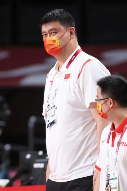 Yao Ming of China talks with team personnel during the first half of China's Women's Preliminary Round Group C game against Puerto Rico on day four...