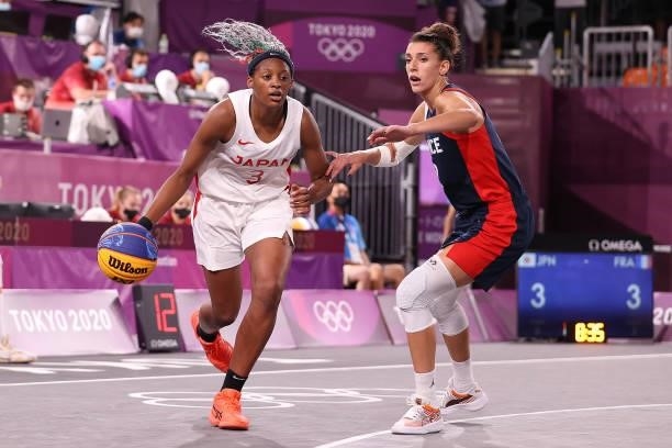 Stephanie Mawuli of Team Japan handles the ball against Laetitia Guapo of Team France in the 3x3 Basketball competition on day four of the Tokyo 2020...