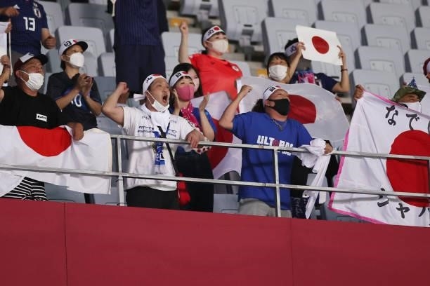 Fans of Team Japan celebrate their side's victory after the Women's Group E match between Chile and Japan on day four of the Tokyo 2020 Olympic Games...