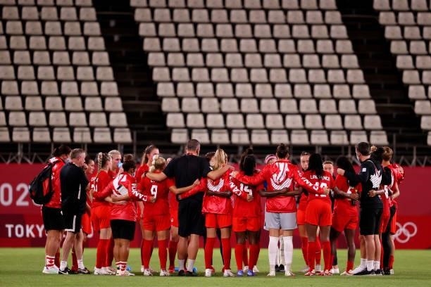 Players of Team Canada form a huddle following the Women's Group E match between Canada and Great Britain on day four of the Tokyo 2020 Olympic Games...