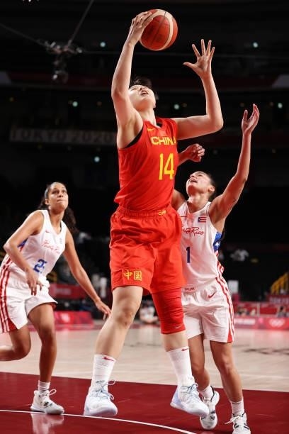 Yueru Li of Team China pulls down a rebound over Tayra Melendez of Team Puerto Rico during the second half of a Women's Preliminary Round Group C...