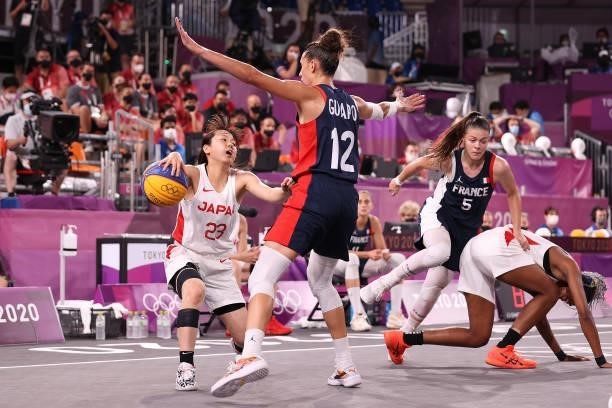 Mai Yamamoto of Team Japan handles the ball against Laetitia Guapo of Team France in the 3x3 Basketball competition on day four of the Tokyo 2020...