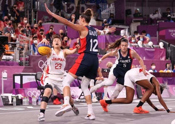 Mai Yamamoto of Team Japan handles the ball against Laetitia Guapo of Team France in the 3x3 Basketball competition on day four of the Tokyo 2020...