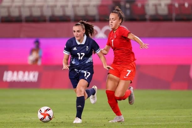 Georgia Stanway of Team Great Britain runs with the ball whilst under pressure from Julia Grosso of Team Canada during the Women's Group E match...