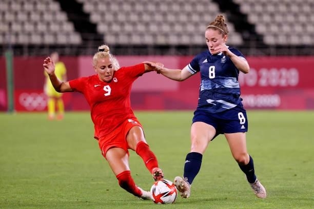 Adriana Leon of Team Canada battles for possession with Kim Little of Team Great Britainduring the Women's Group E match between Canada and Great...