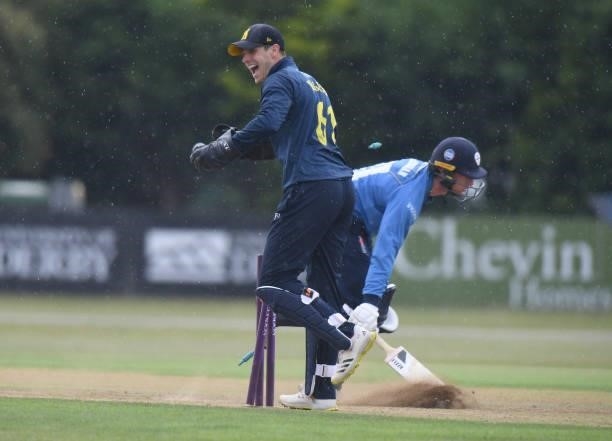 Mattie McKiernan of Derbyshire is run out by Michael Burgess of Warwickshire during the Royal London Cup match between Derbyshire and Warwickshire at...