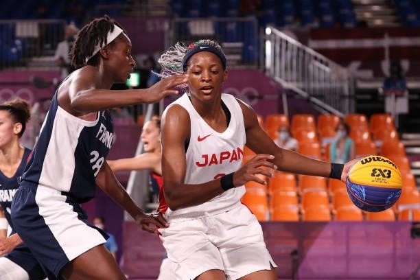 Stephanie Mawuli of Team Japan handles the ball against Mamignan Toure of Team France in the 3x3 Basketball competition on day four of the Tokyo 2020...