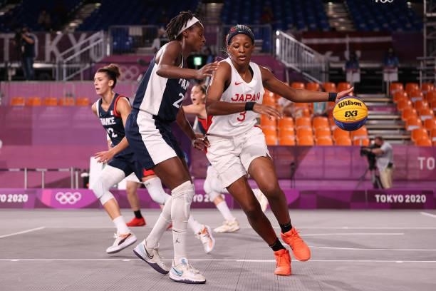 Stephanie Mawuli of Team Japan handles the ball against Mamignan Toure of Team France in the 3x3 Basketball competition on day four of the Tokyo 2020...
