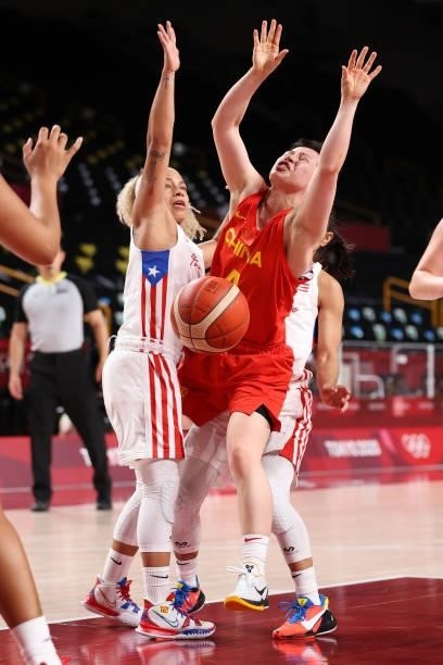Yuan Li of Team China loses possession of the ball as she's defended by Dayshalee Salaman of Team Puerto Rico during the second half of a Women's...