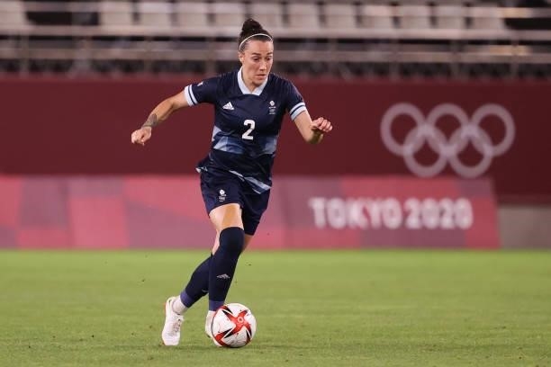 Lucy Bronze of Team Great Britain runs with the ball during the Women's Group E match between Canada and Great Britain on day four of the Tokyo 2020...