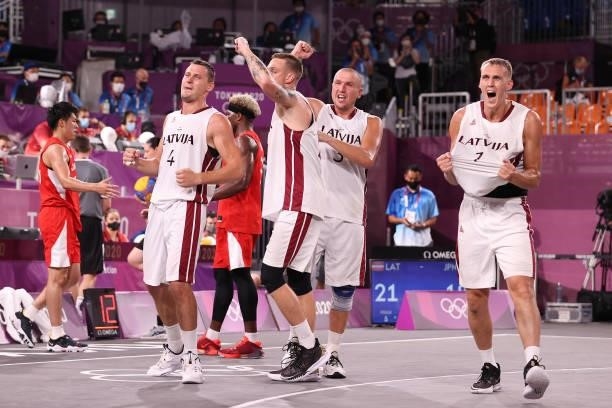 Agnis Cavars, Karlis Lasmanis, Edgars Krumins and Nauris Miezis of Team Latvia celebrate victory in the 3x3 Basketball competition on day four of the...
