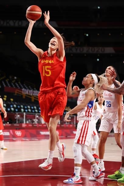 Xu Han of Team China drives to the basket against Dayshalee Salaman of Team Puerto Rico during the second half of a Women's Preliminary Round Group C...