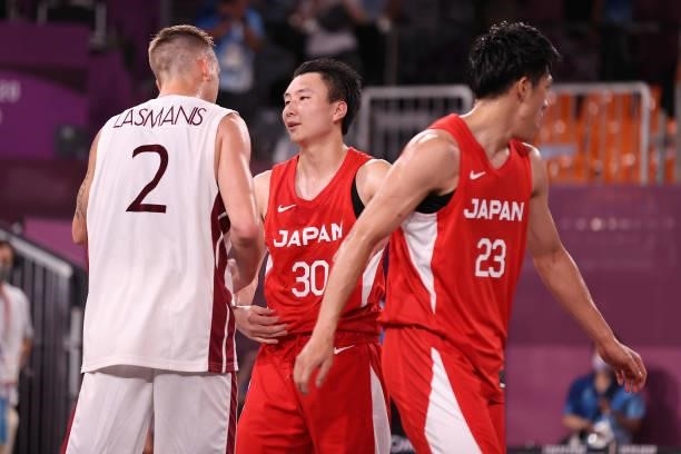 Karlis Lasmanis of Team Latvia speaks with Keisei Tominaga of Team Japan after the game in the 3x3 Basketball competition on day four of the Tokyo...