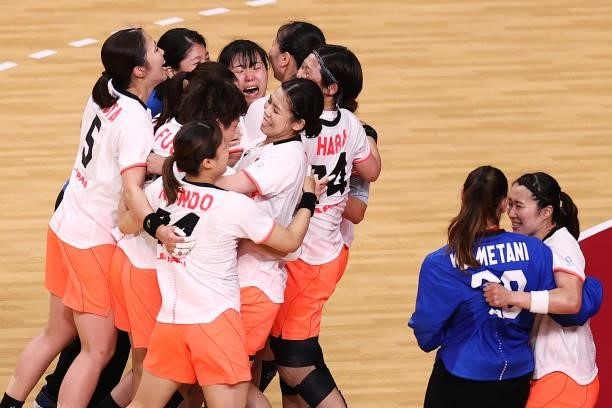 Team Japan players celebrate after winning the Woman's Preliminary Round Group A match between Japan and Montenegro on day four of the Tokyo 2020...