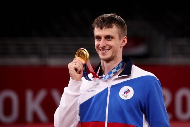 Gold medalist Vladislav Larin of Team ROC poses with the gold medal for the Men's +80kg Taekwondo on day four of the Tokyo 2020 Olympic Games at...