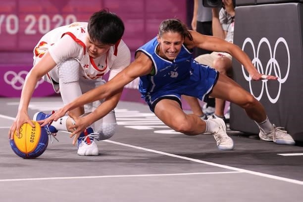 Jiyuan Wan of Team China competes for the ball against Chiara Consolini of Team Italy in the 3x3 Basketball competition on day four of the Tokyo 2020...
