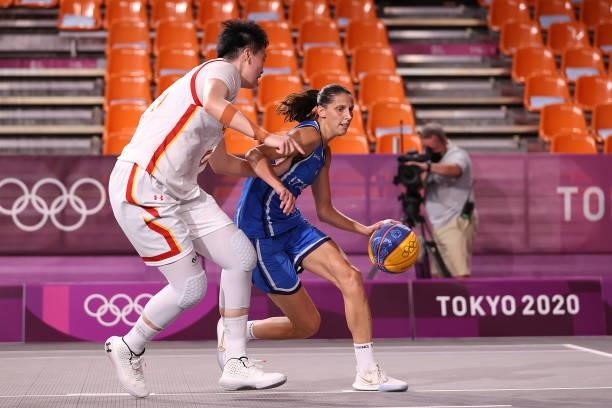 Chiara Consolini of Team Italy handles the ball against Zhiting Zhang of Team China in the 3x3 Basketball competition on day four of the Tokyo 2020...