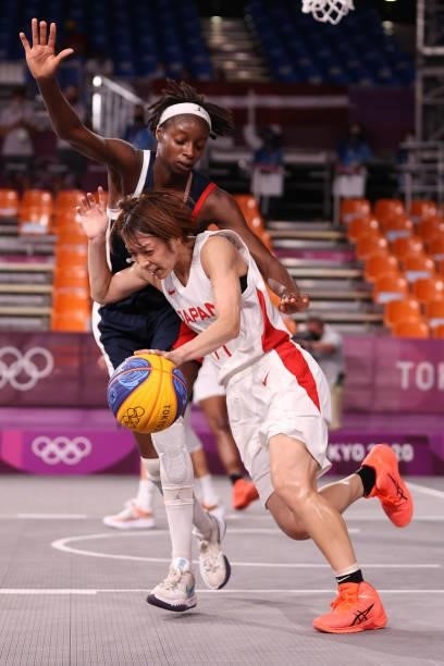Mio Shinozaki of Team Japan handles the ball against Mamignan Toure of Team France in the 3x3 Basketball competition on day four of the Tokyo 2020...