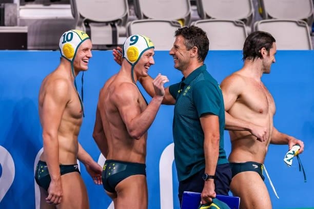 Timothy Putt of Australia, Andrew Ford of Australia, head coach Elvis Fatovic of Australia during the Tokyo 2020 Olympic Waterpolo Tournament men...