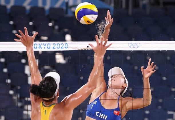 Fan Wang of Team China competes against Agatha Bednarczuk of Team Brazil during the Women's Preliminary - Pool C beach volleyball on day four of the...
